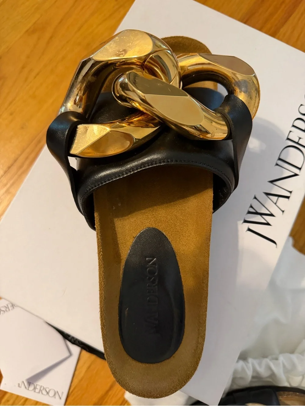JW Anderson Women’s Black Slide Sandals with Gold Chain Accent